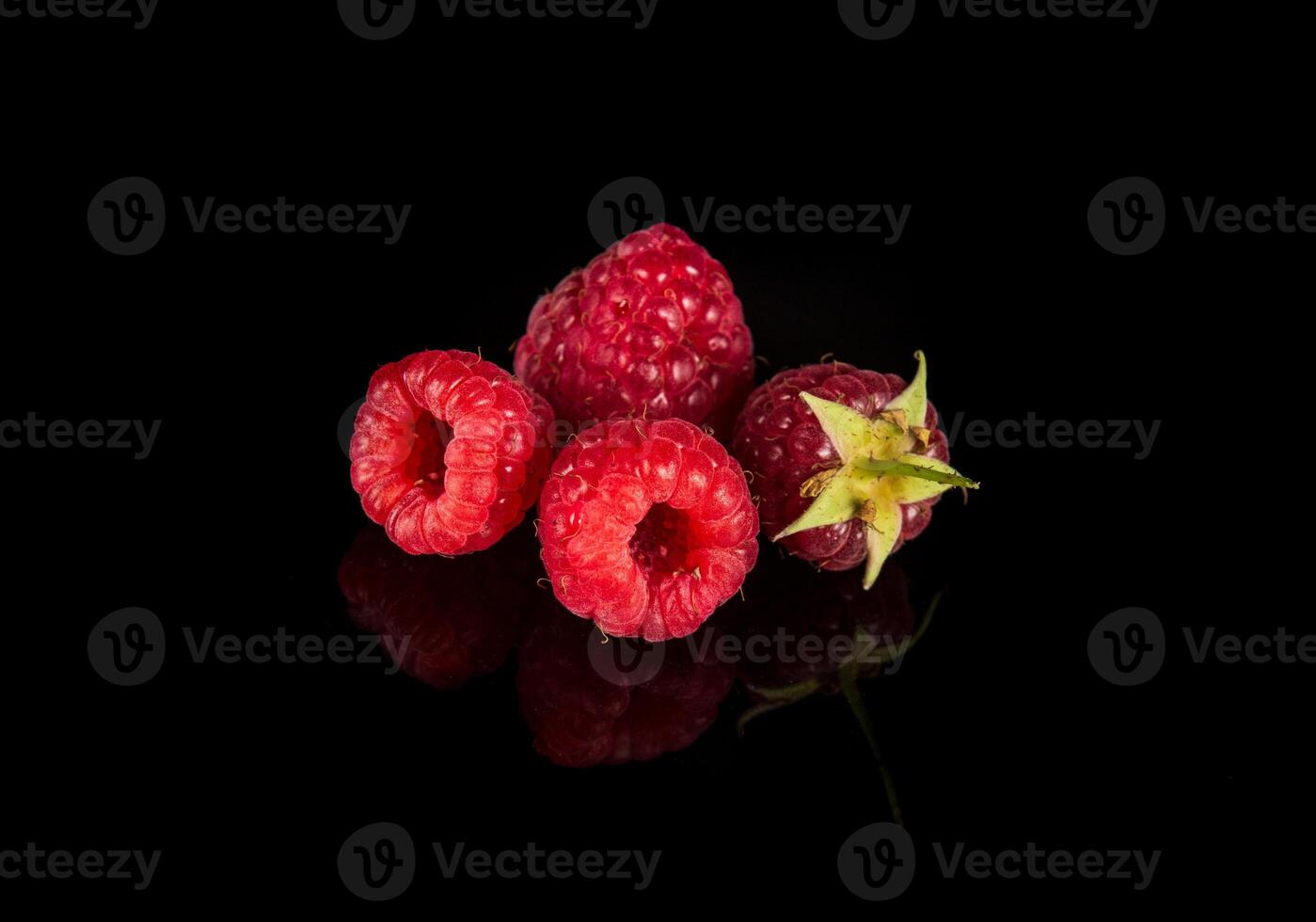 Raspberry isolated. Raspberries with leaf isolate. Raspberry with leaf isolated on black background. Free advertising space photo