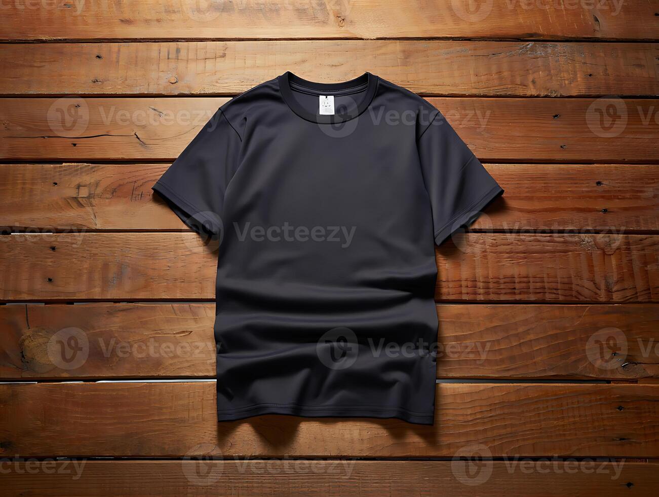 A black tshirt is neatly arranged on a rustic wooden surface, creating a visually appealing contrast and texture photo