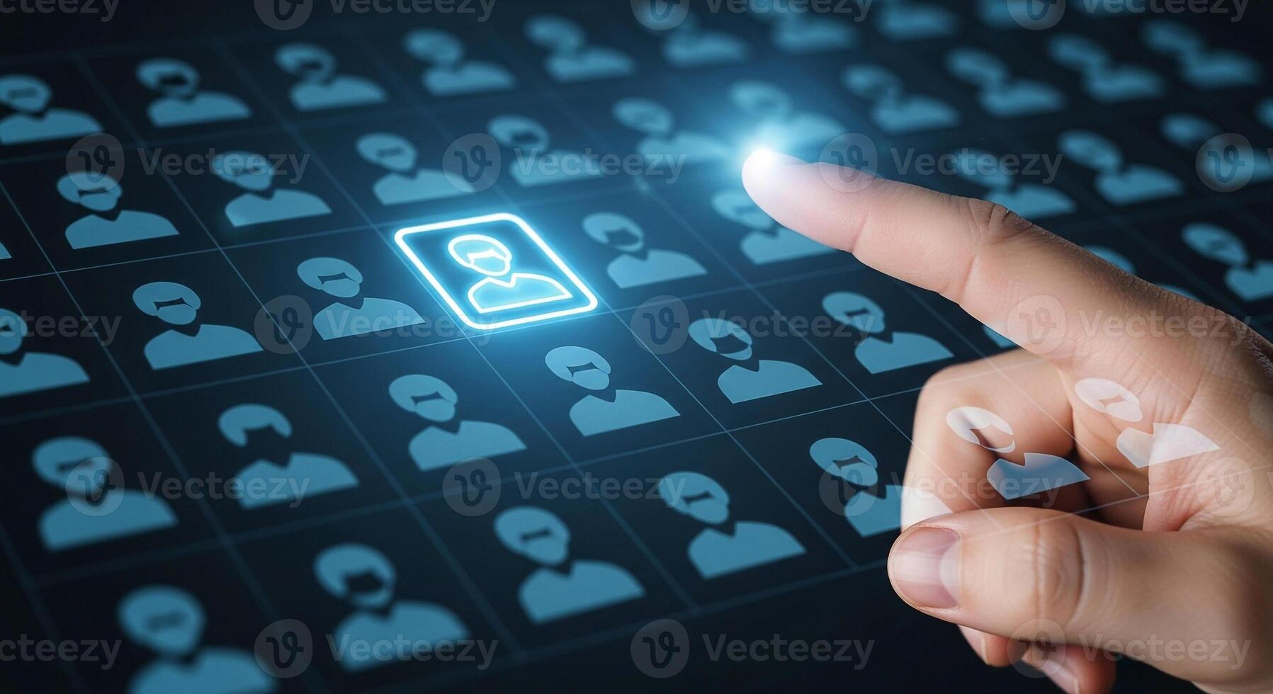 Hand selecting a digital profile from a grid of candidates on a touchscreen representing the concept of recruitment talent search and human resource management in a modern technological setting photo