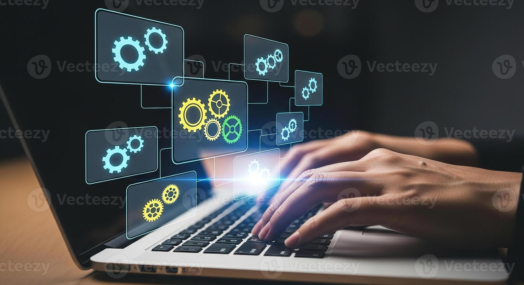 Person working on laptop computer with digital gears interface showcasing technology innovation and process optimization in a dark setting This image represents efficiency problem-solving and digital photo