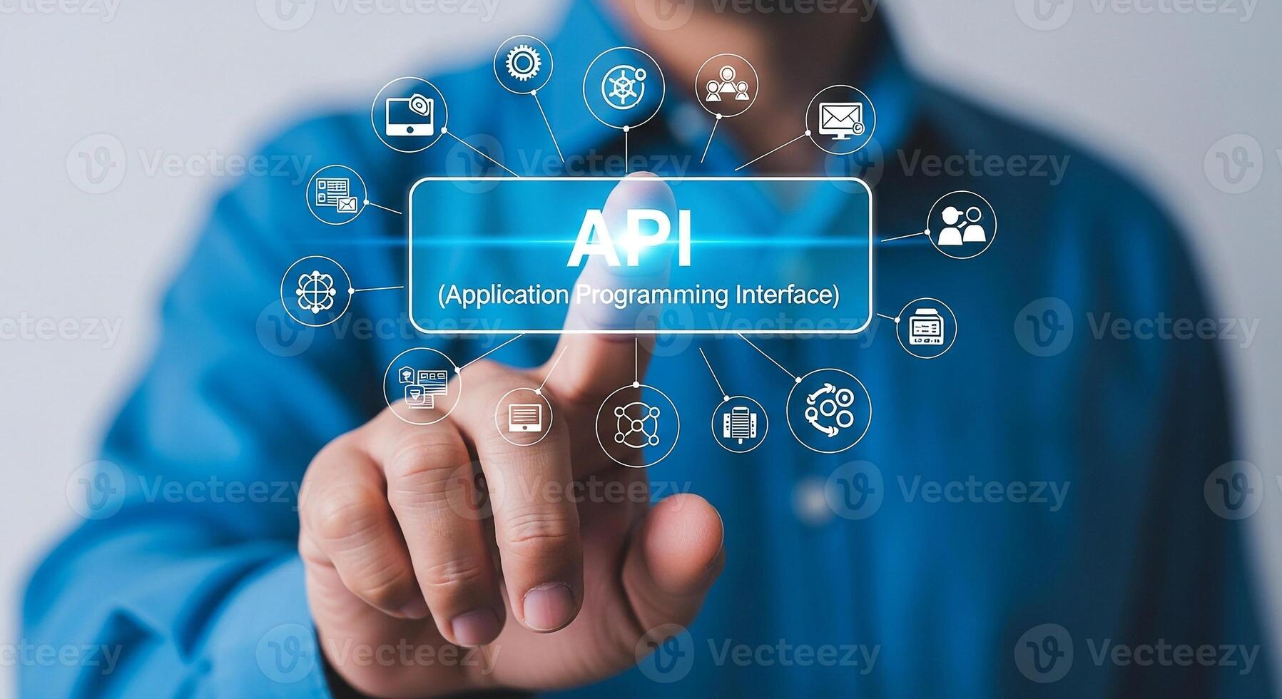 Man Interacting with Futuristic API Interface A Close-up of a Persons Finger Touching a Transparent Screen Displaying API Application Programming Interface with Related Technology Icons Symbolizing Di photo