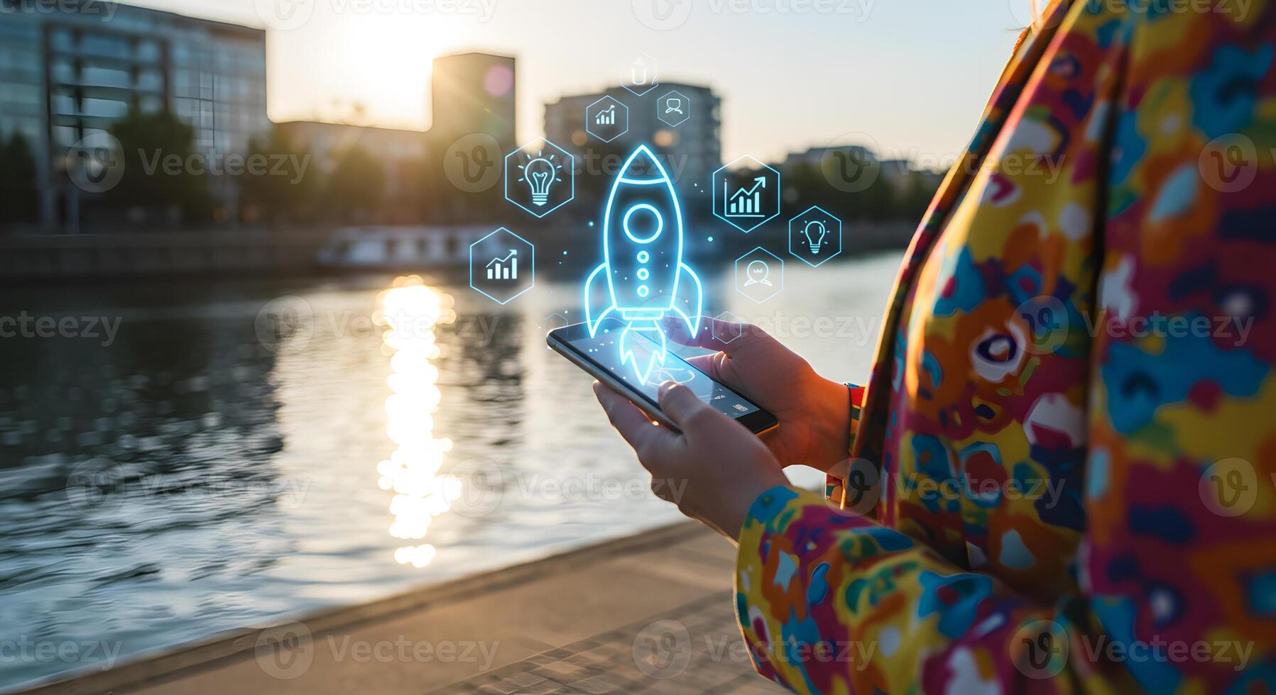 Woman using smartphone app to launch business innovative startup rocket interface displayed on screen urban waterfront setting at sunset concept of future success and digital growth photo