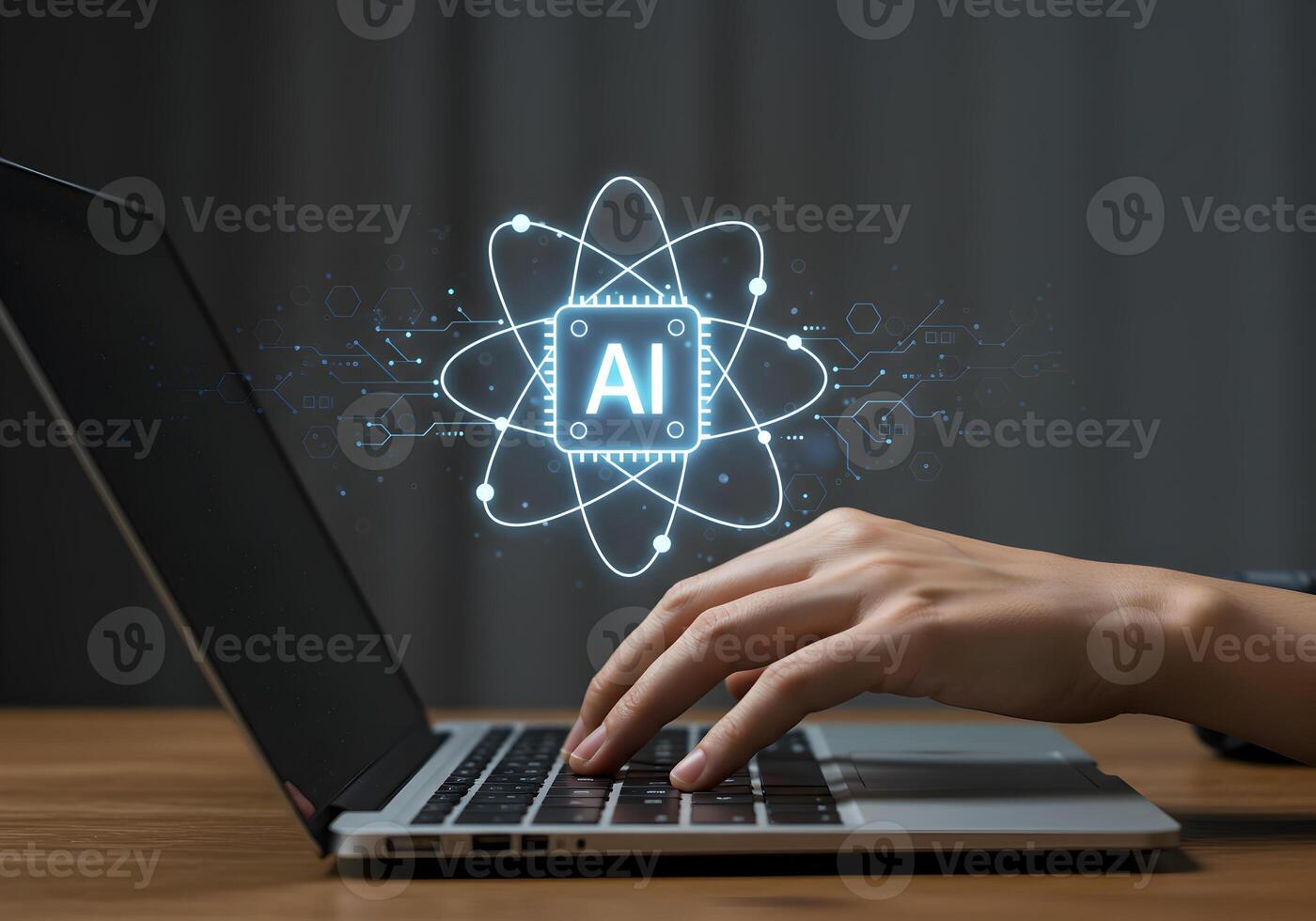 Person using laptop computer working with AI atom symbol technology innovation future digital transformation artificial intelligence modern workplace desk night dark background glowing bright illumina photo