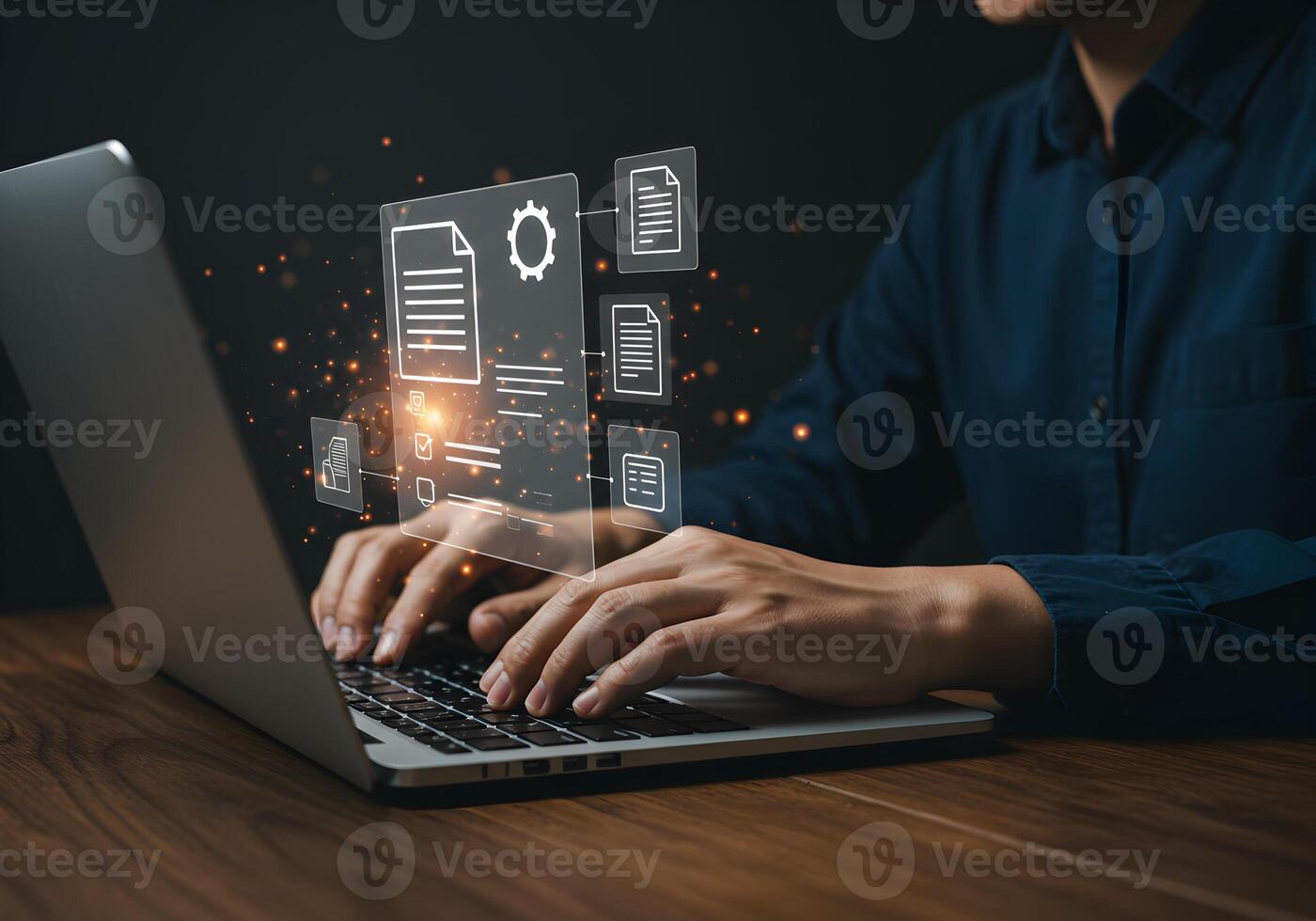 Person working on laptop with digital document interface managing files and data in a dark modern office showcasing efficient workflow and digital transformation concept photo