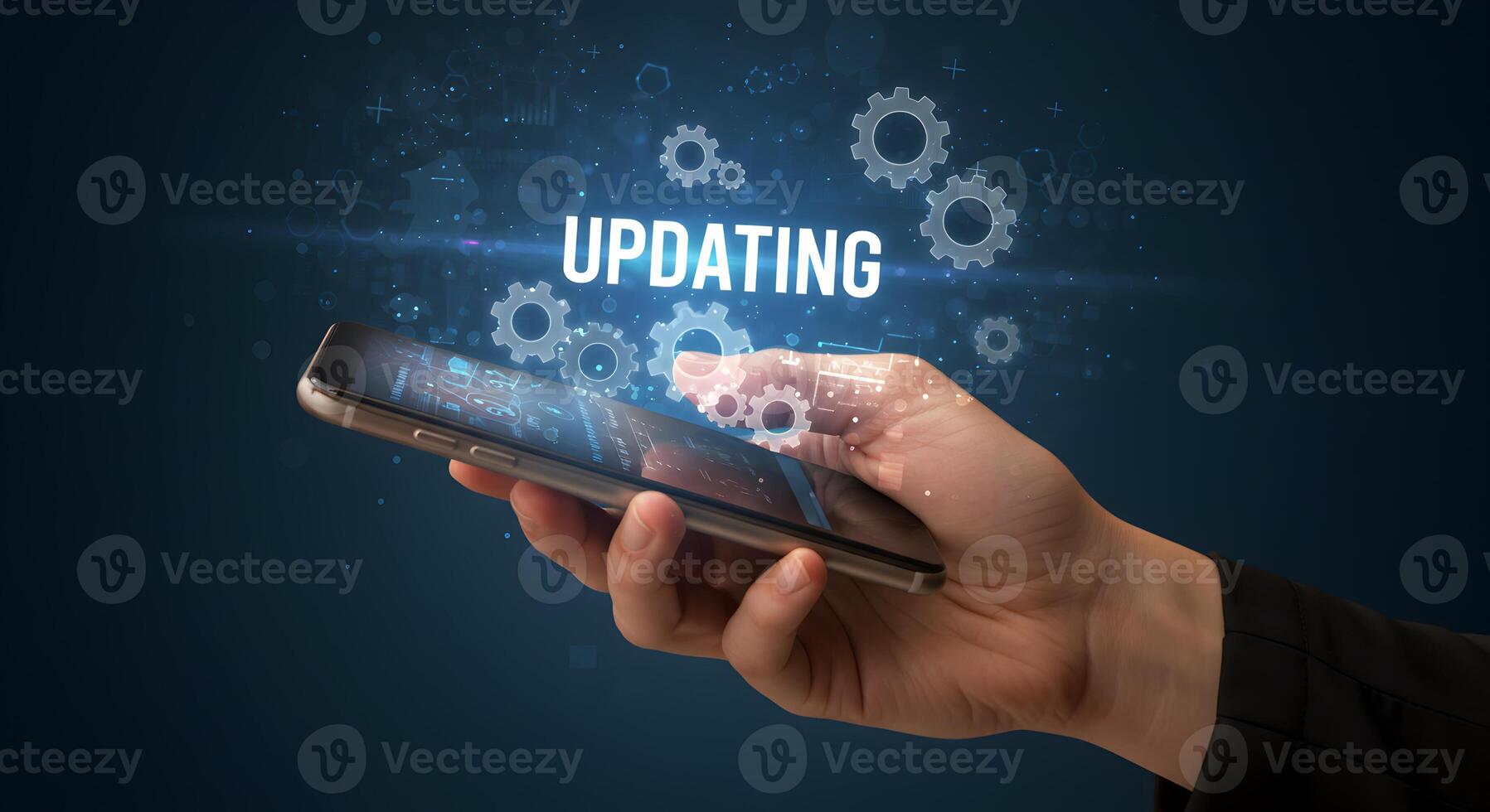 Hand using smartphone to update software digital gears and updating text on screen technology concept image photo