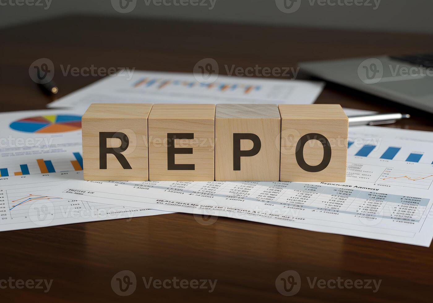 REPO Rate Spelled on Wooden Blocks on Financial Documents Showing Charts and Graphs on a Desk in an Office Setting Representing Financial Concepts and Market Analysis photo
