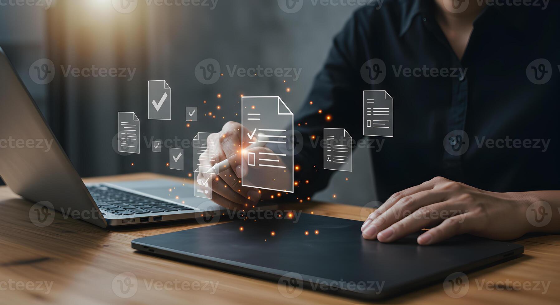 Person reviewing and approving digital documents using a stylus on a graphics tablet at a modern workspace signifying efficient workflow and successful project completion photo