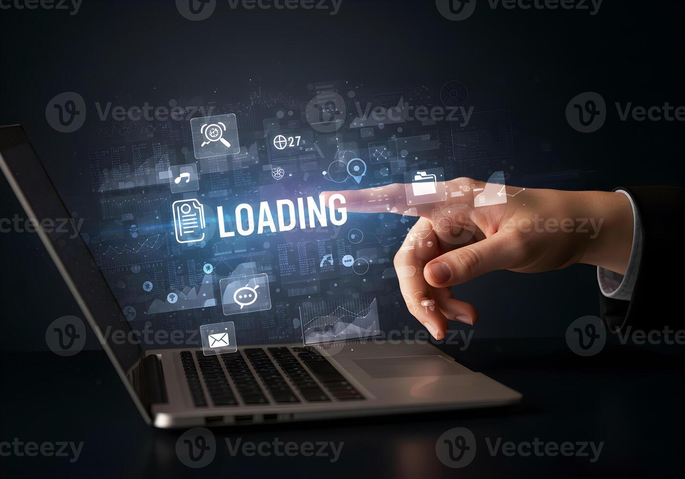 Hand interacting with a laptop screen displaying the word LOADING surrounded by digital icons representing the concept of data processing and progress in a modern technological setting The image evoke photo