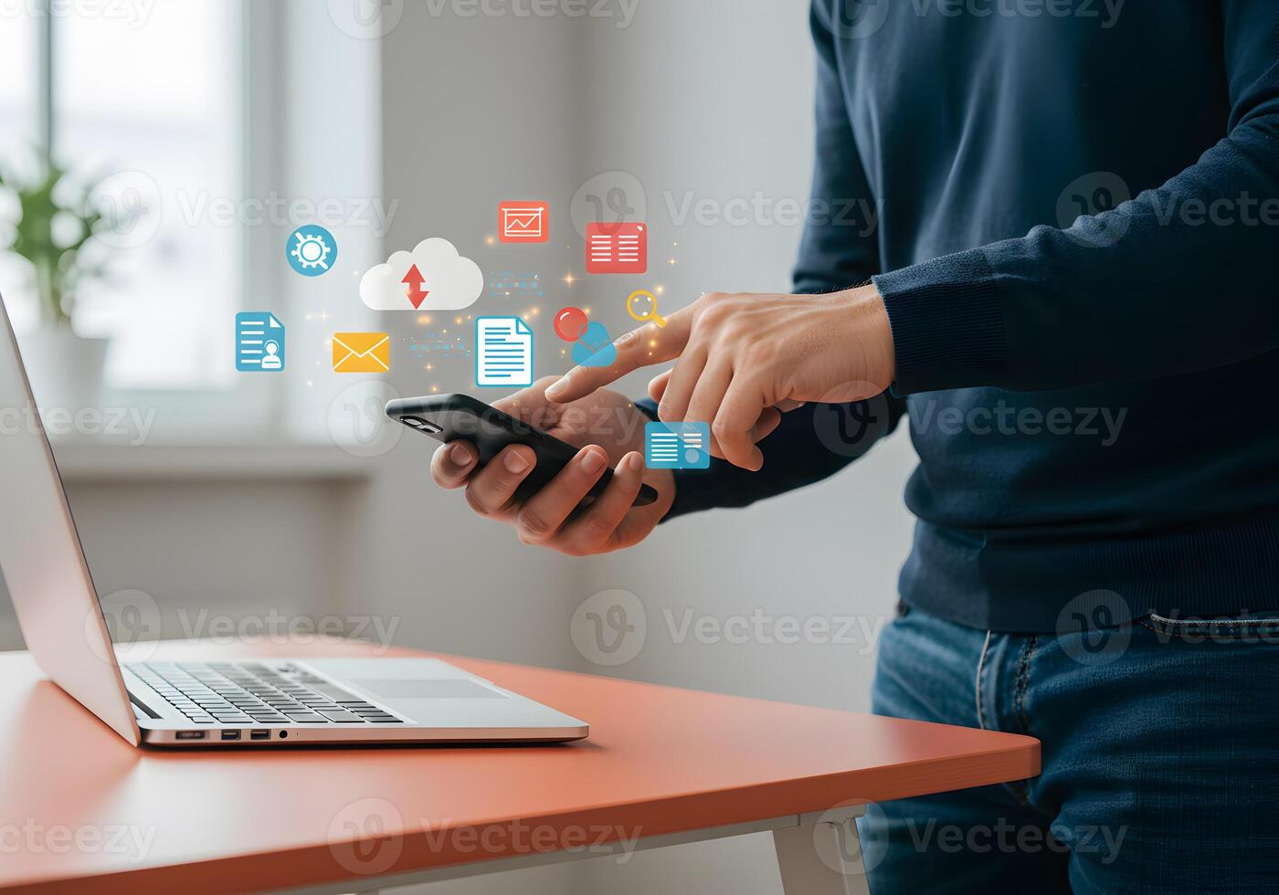 Man using smartphone to manage digital files and data in a modern home office showcasing efficient remote work and cloud technology photo