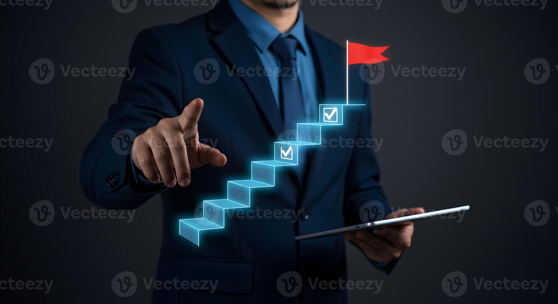 Businessman using digital tablet pointing at a glowing staircase leading to success symbolized by a red flag representing growth achievement and progress in business and career photo