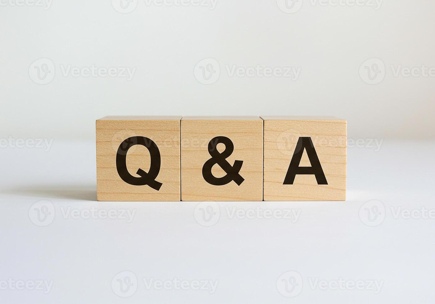 Wooden Blocks Spelling QA on White Background Questions and Answers Concept for FAQ Support and Help Desk Solutions photo