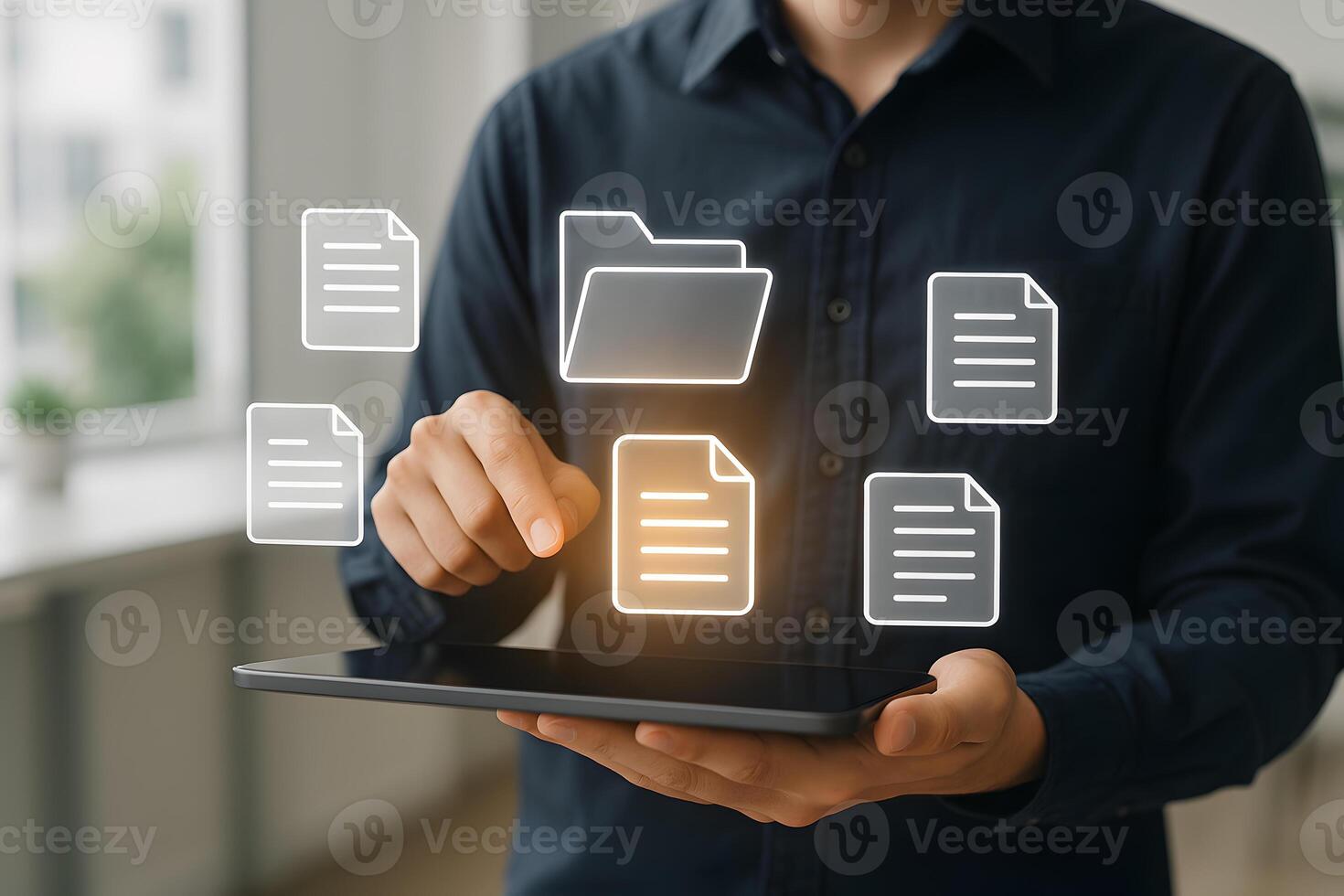 Man using digital tablet managing documents and files in a modern office concept of digital workspace and efficient workflow photo