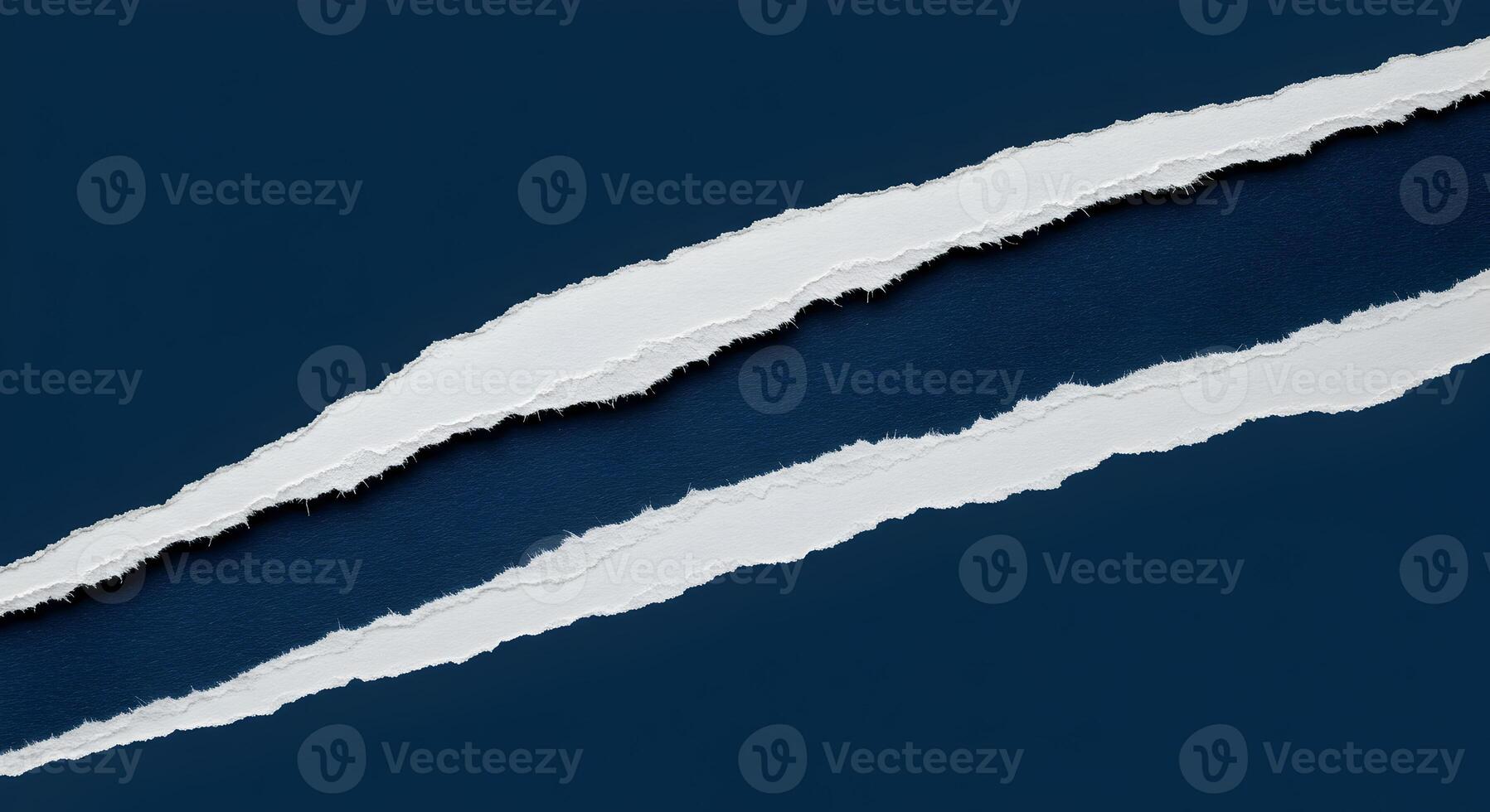 White paper ripped apart on a dark blue background creating a dramatic and textured design element ideal for presentations websites or advertising This image evokes a sense of mystery and intrigue sug photo