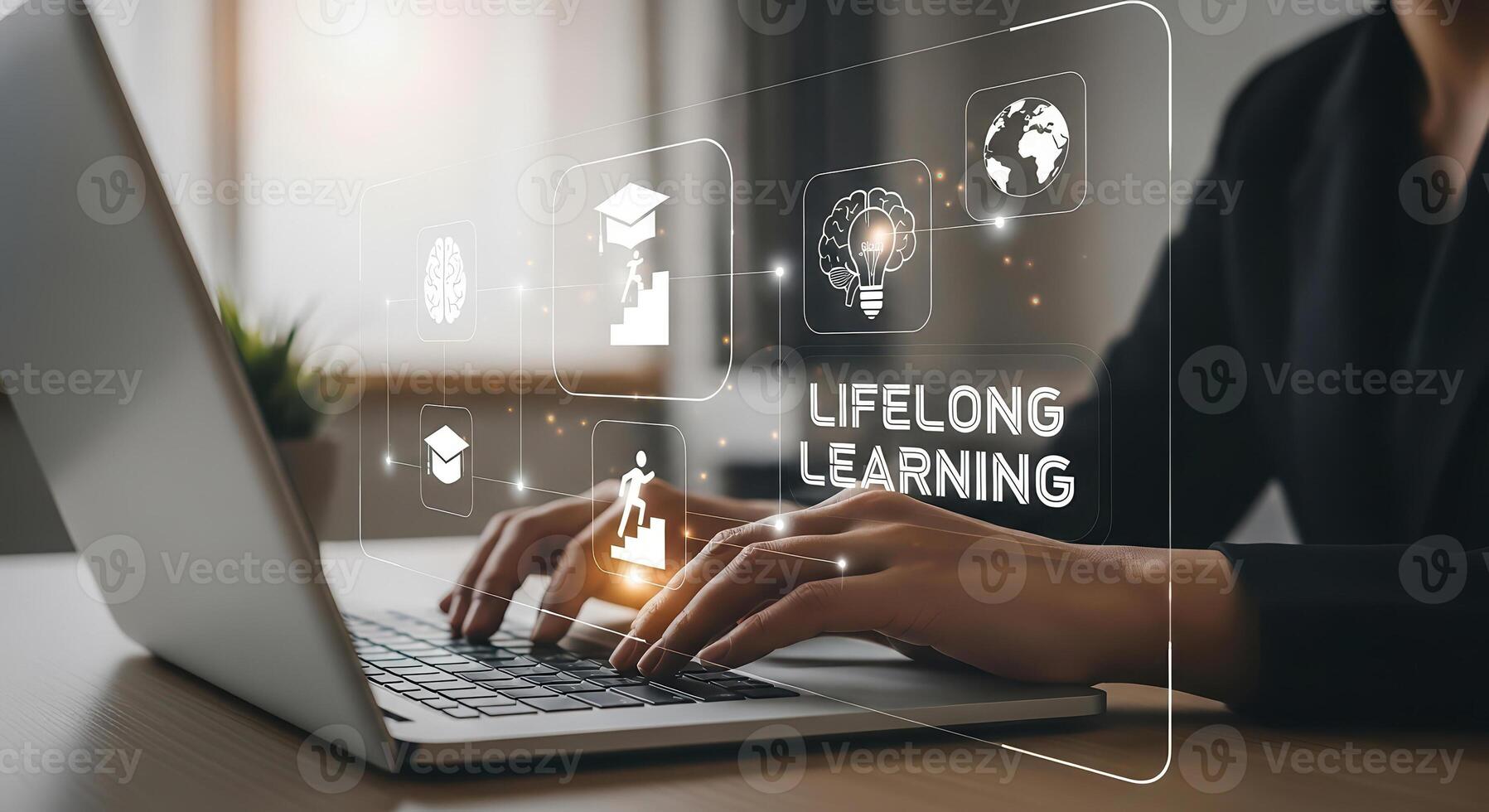 A person working on a laptop, emphasizing lifelong learning and continuous self-improvement. photo