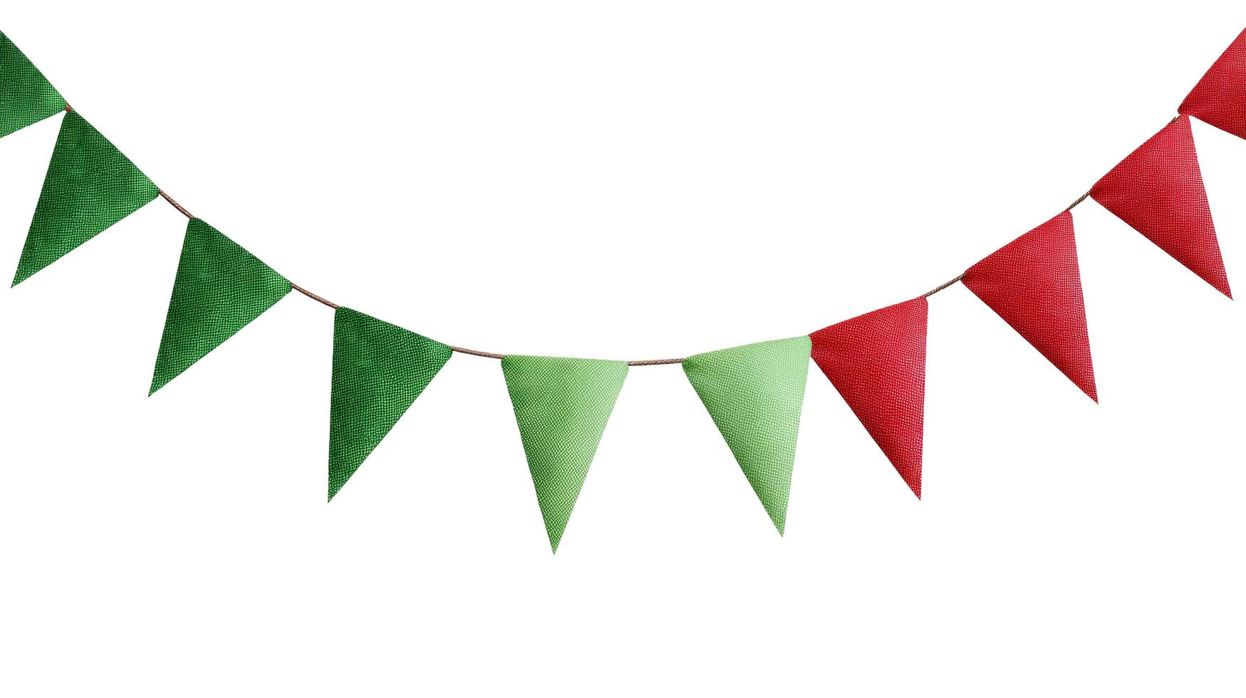 Festive garland with alternating green and red triangular flags hanging on a thin string isolated photo