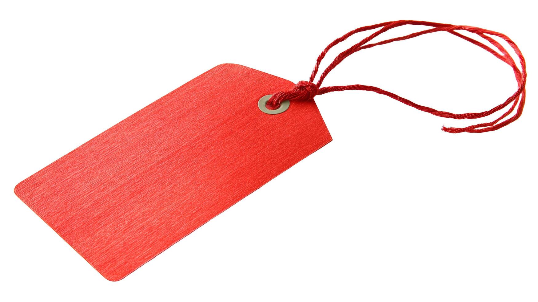 A vibrant crimson tag with string attached against a pristine white backdrop in a studio setting photo