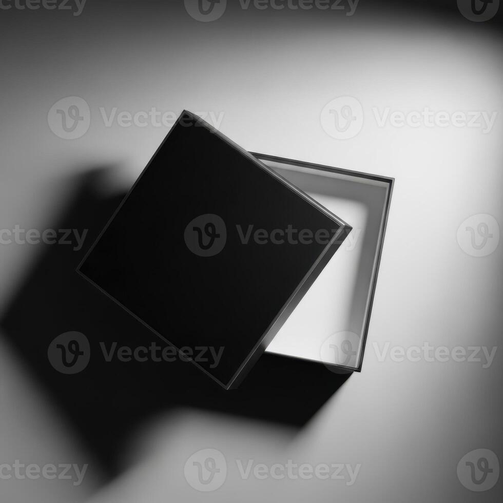 An open black gift box with its lid partially removed casting a shadow isolated on white background photo