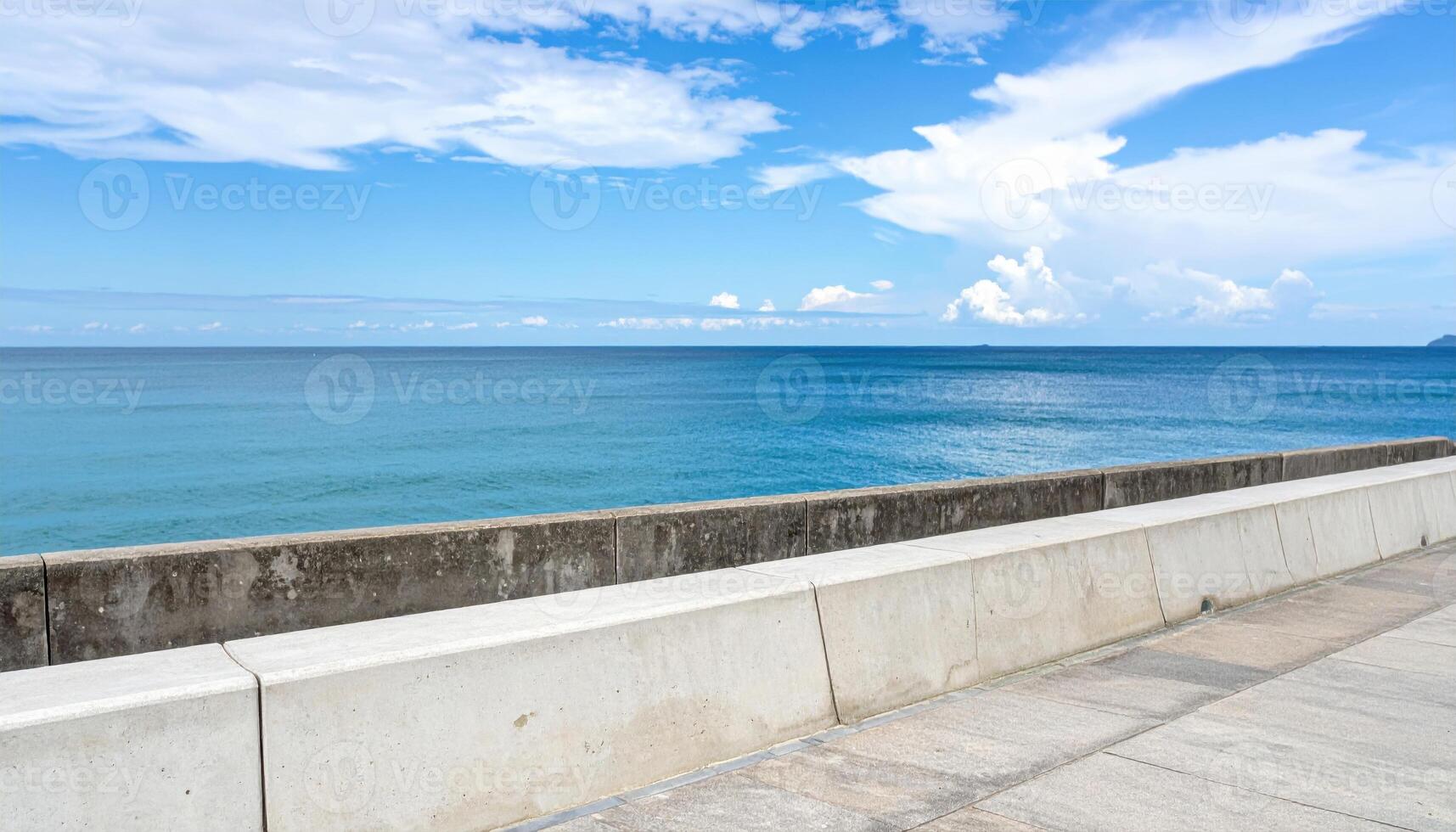 Seawall parapet line with distant horizon banner ready space wallpaper background representing coastal structure suitable for modern minimal design and editorial use photo