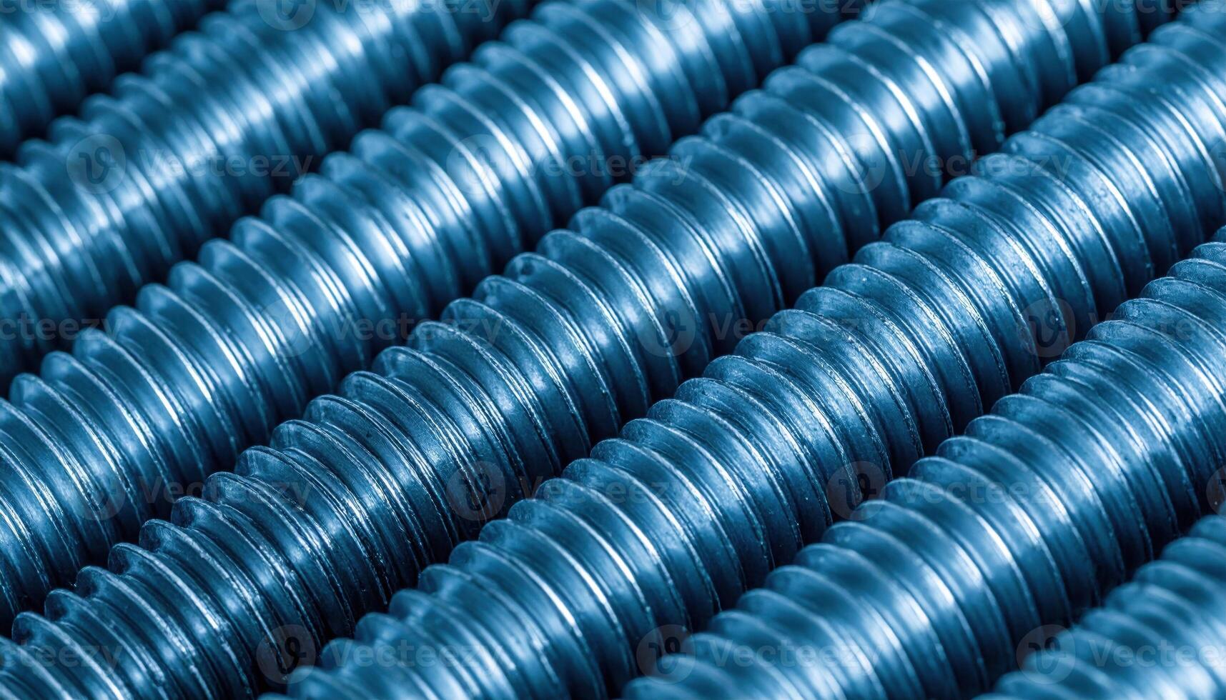 Steel bolt threads with precise helix cool tones and top copy field representing engineering detail suitable for industry product and technology design photo