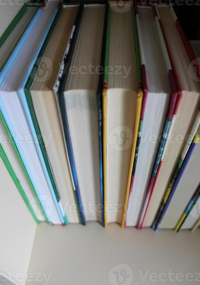 Books in a hard cover are arranged with a book block towards the viewer photo