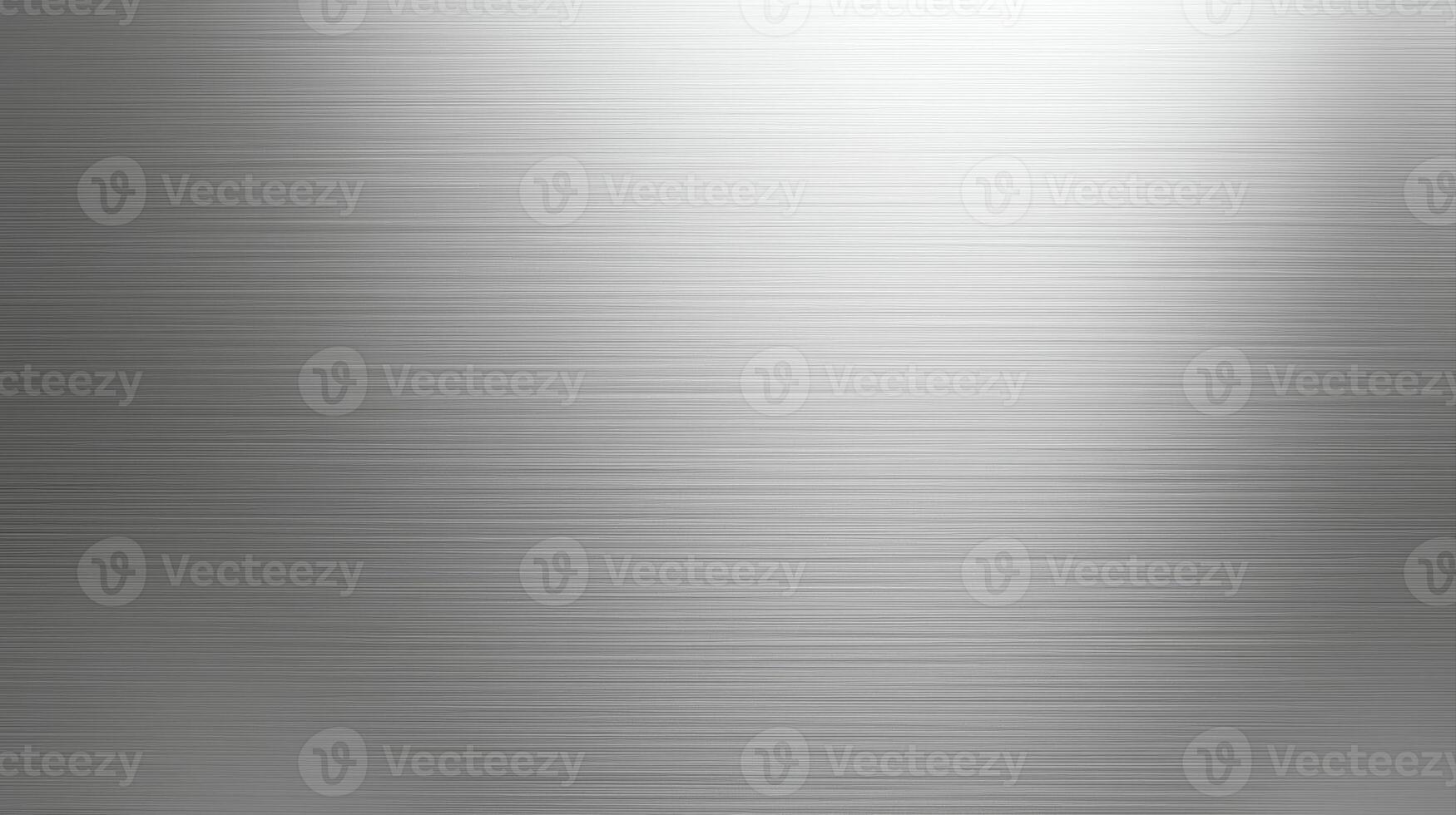 Subtle light reflects across a brushed metal surface, creating a cool, industrial texture perfect for backgrounds or design elements for technology themes. photo