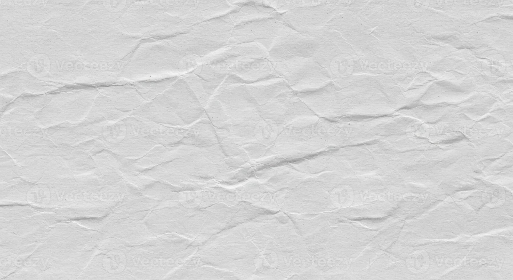 Subtle white background of wrinkled paper with soft shadows and delicate texture creates an elegant, versatile surface perfect for various design applications. photo