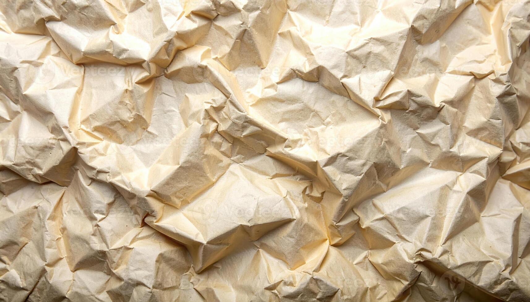 Close up of wrinkled brown paper texture with many folds and creases creating a visually interesting pattern suitable for graphic design projects background. photo