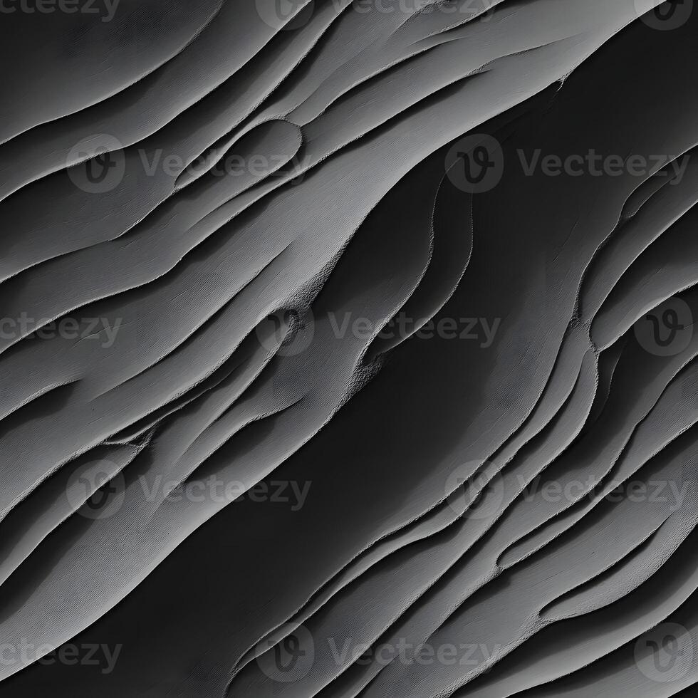 Abstract grayscale close up shows dynamic wavy textured patterns with fluid organic shapes and gradients. photo
