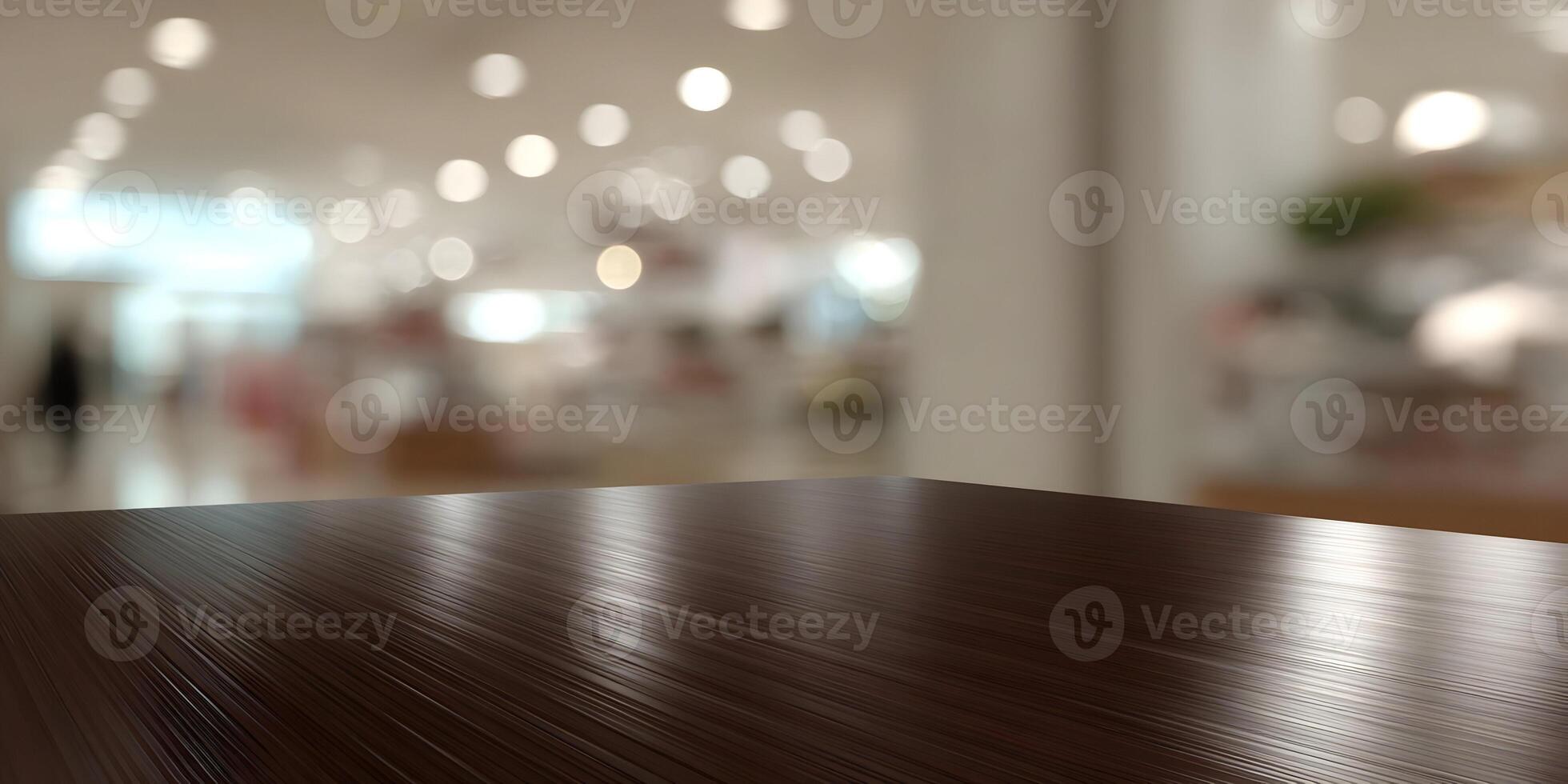 A reflective dark wood table surface rests in front of a soft focus indoor setting with bokeh lights photo