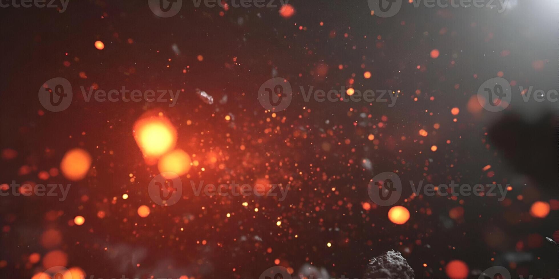 Warm glowing orange and yellow bokeh particles create a fiery abstract background texture photo