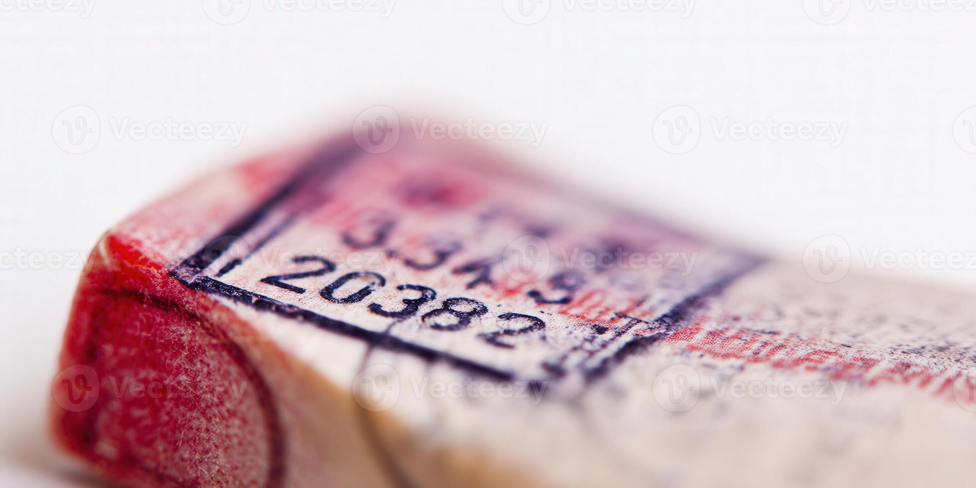 Close-up shot of a cork with printed numbers and a stamp in soft focus. photo