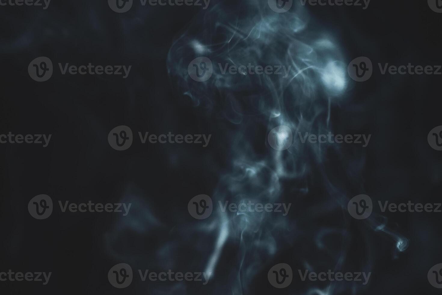 Ethereal Smoke Swirls on Dark Background Creating a Mysterious and Atmospheric Abstract Visual Effect photo