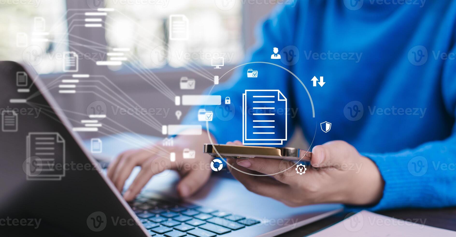 Businesswoman working on laptop with virtual screen Online documentation database, IT consultant being set up Virtual Document Management System with a laptop, Software for archiving corporate files. photo