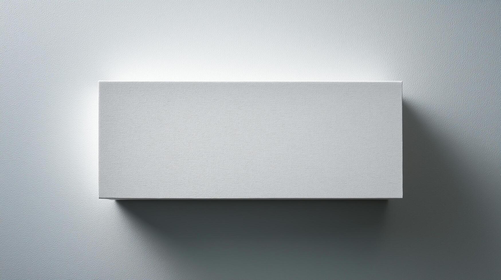 Minimalist blank white canvas on a textured wall, softly lit from above, casting a subtle shadow, perfect for modern art display or mockup design. photo