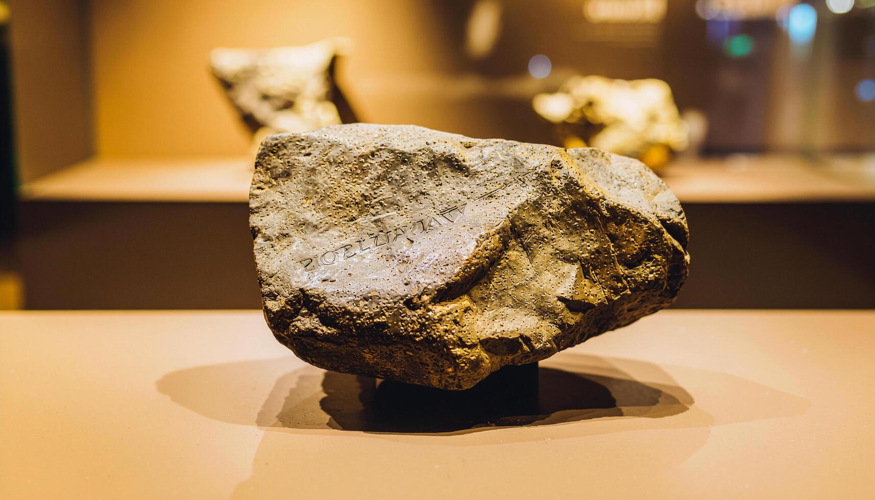 Fossil Swipe Gesture Ancient Stone Tablet Showing Swipe Up for Digital Lithic Memory Amidst Fossilswipe Carving Stonebeige Matrix photo