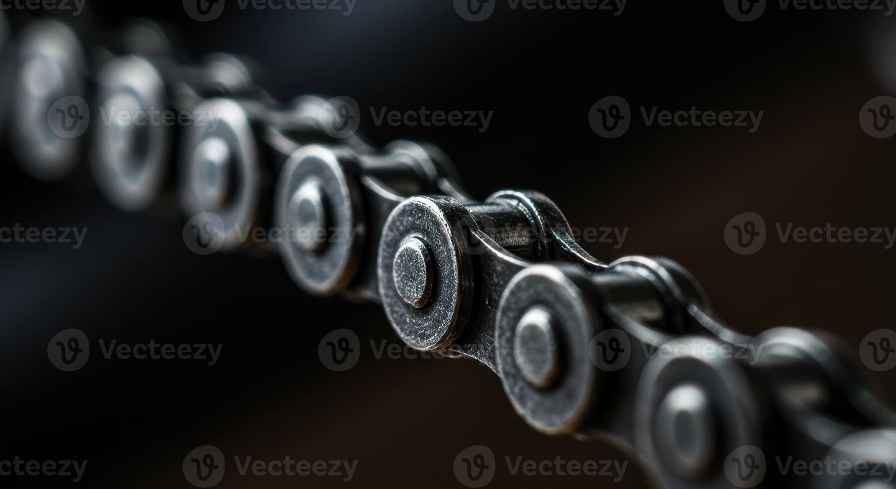 Close up macro shot of a shiny metallic bicycle chain with detailed links on a dark background photo