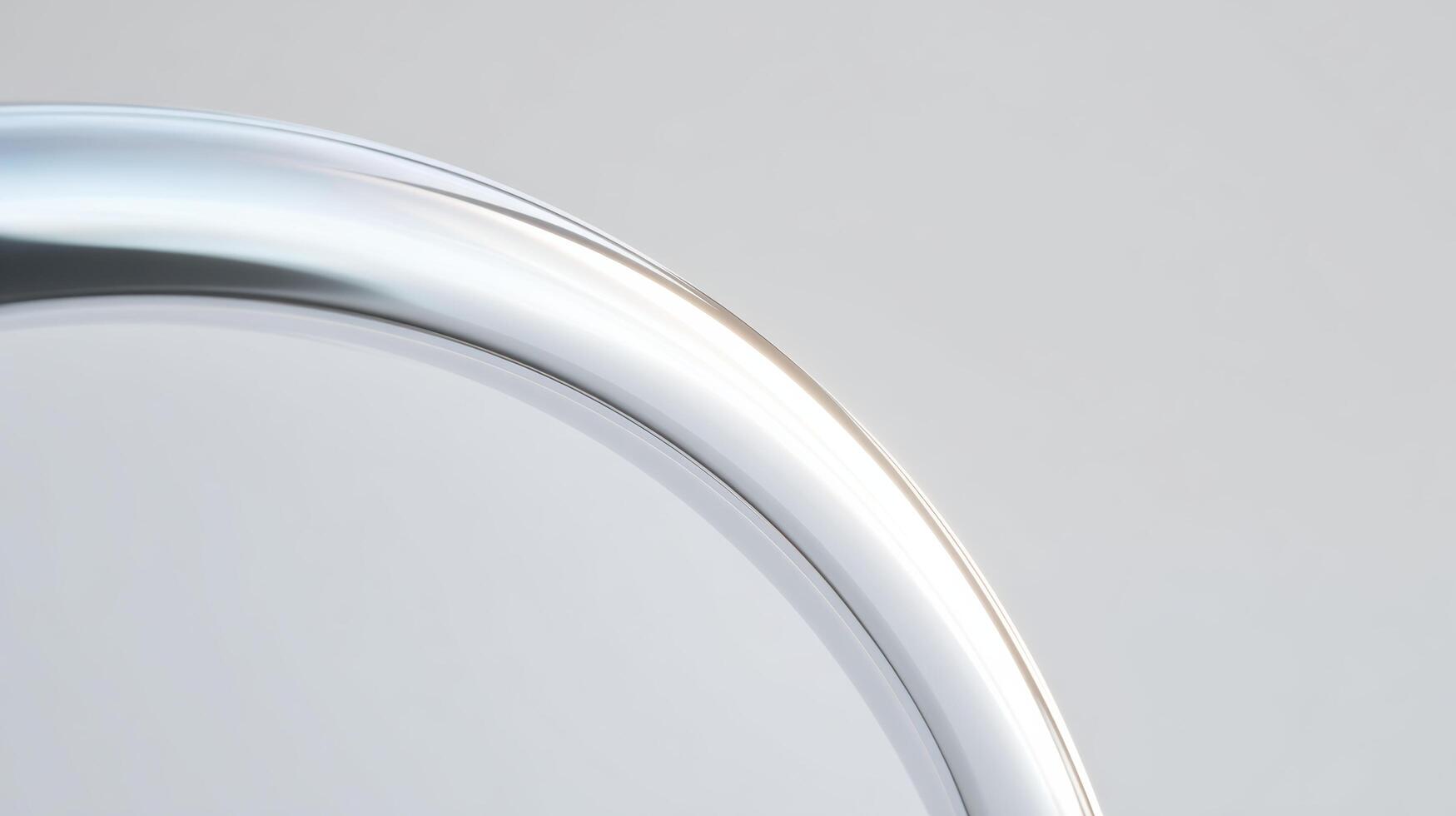 Sleek silver metal curve on minimalist abstract background creating serene feeling. clean surface shows soft reflection, with shallow focus on modern detail photo