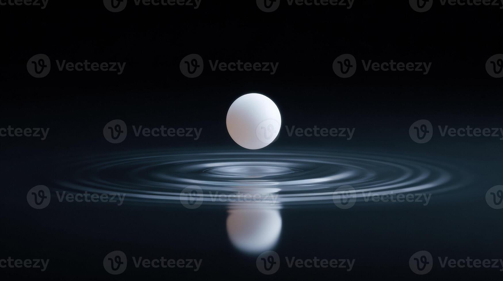 Serene and calm abstract concept of single white sphere making gentle touch on dark water. soft impact creates perfect ripple and subtle reflection. Minimalist photo