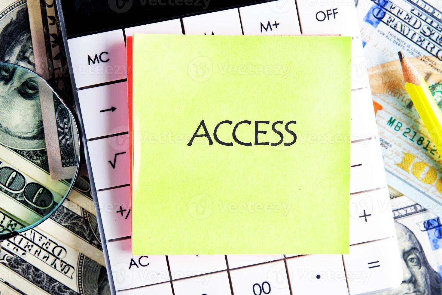 ACCESS word written on the sticker on the calculator on the background of banknotes. Cybersecurity security and encryption concept photo
