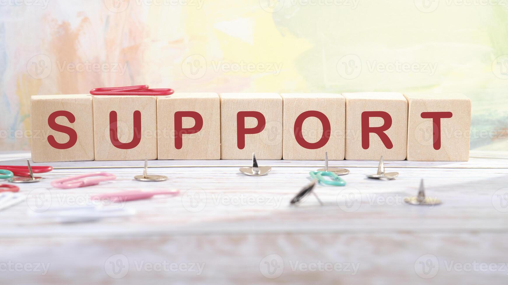 The concept word SUPPORT has been collected of wooden cubes on an abstract background. Business and SUPPORT concept. Copy space photo