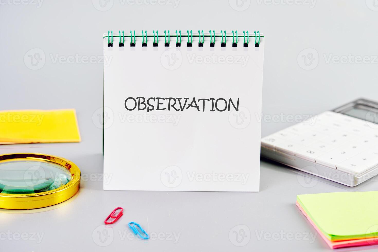 OBSERVATION word written in a notebook in a composition with a calculator, a magnifying glass, and stickers. Observation concept image photo