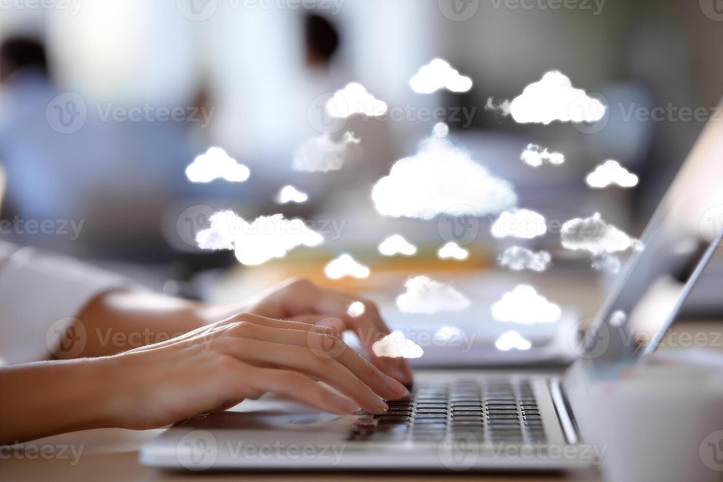 Cloud computing concept - businesswoman using laptop with cloud computing icons on screen photo