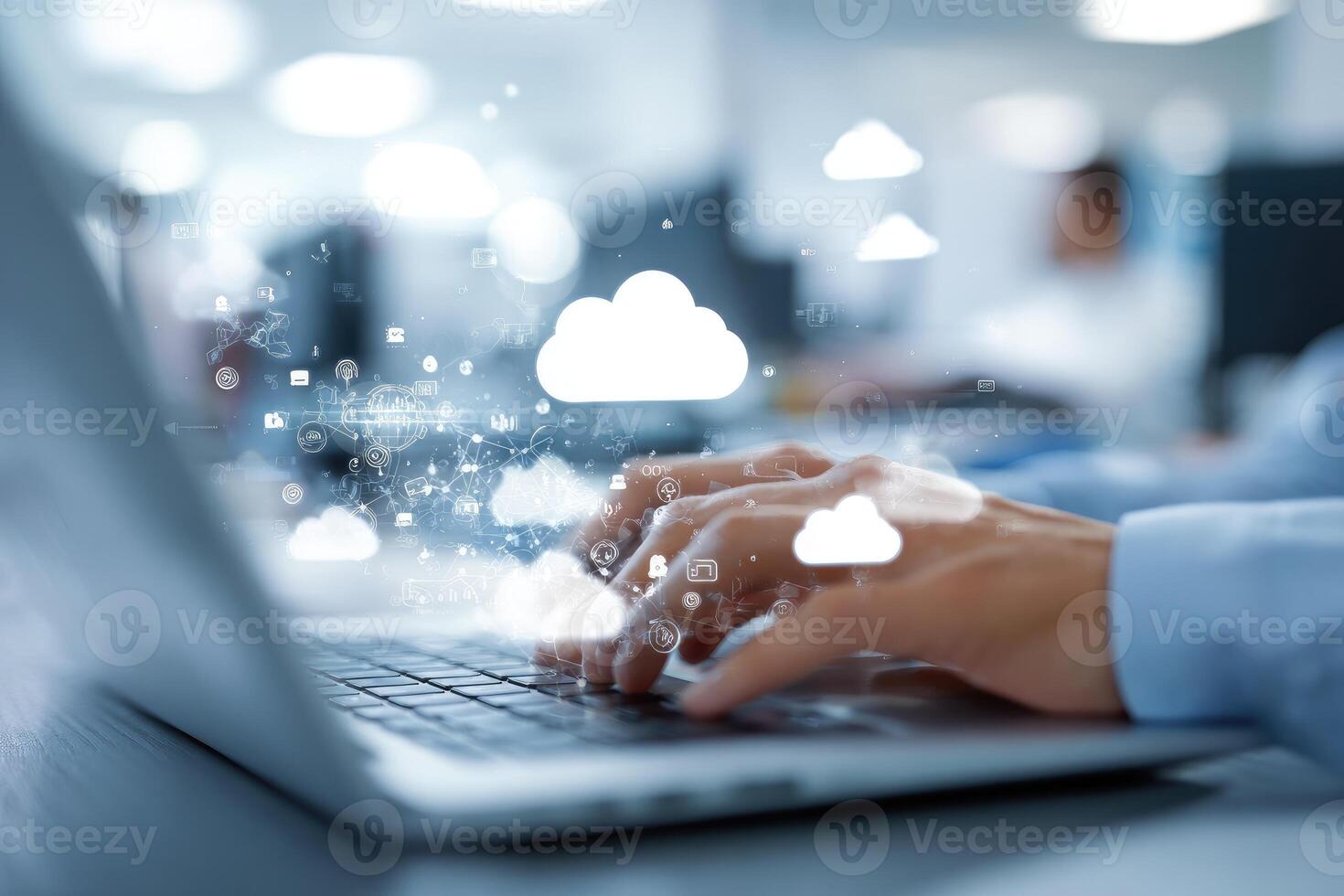 Cloud computing concept - business person typing on laptop with cloud computing icons photo