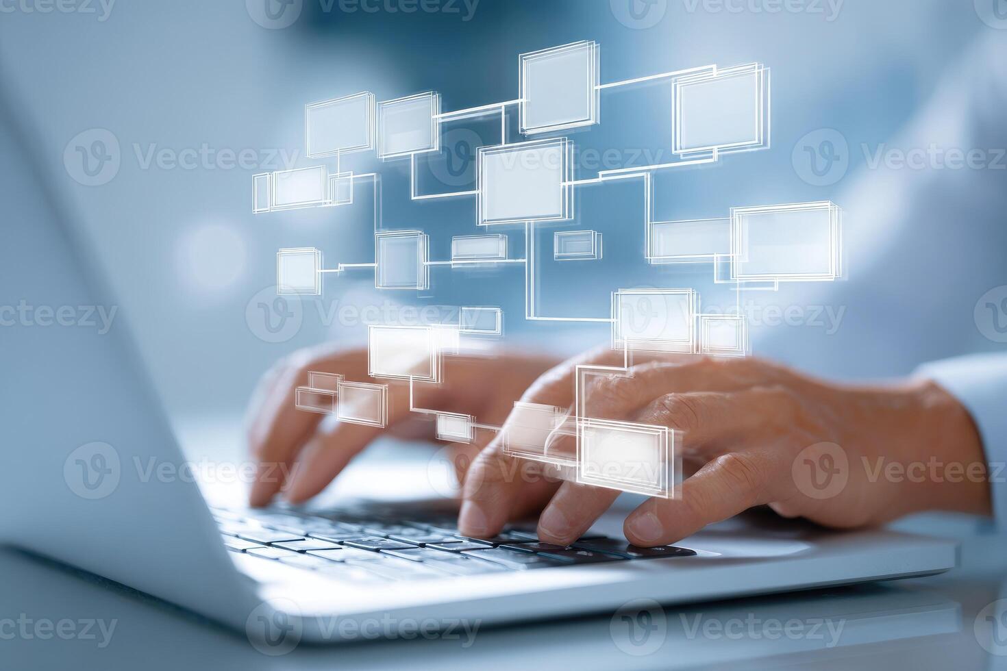 A person typing on a laptop computer with a network diagram photo