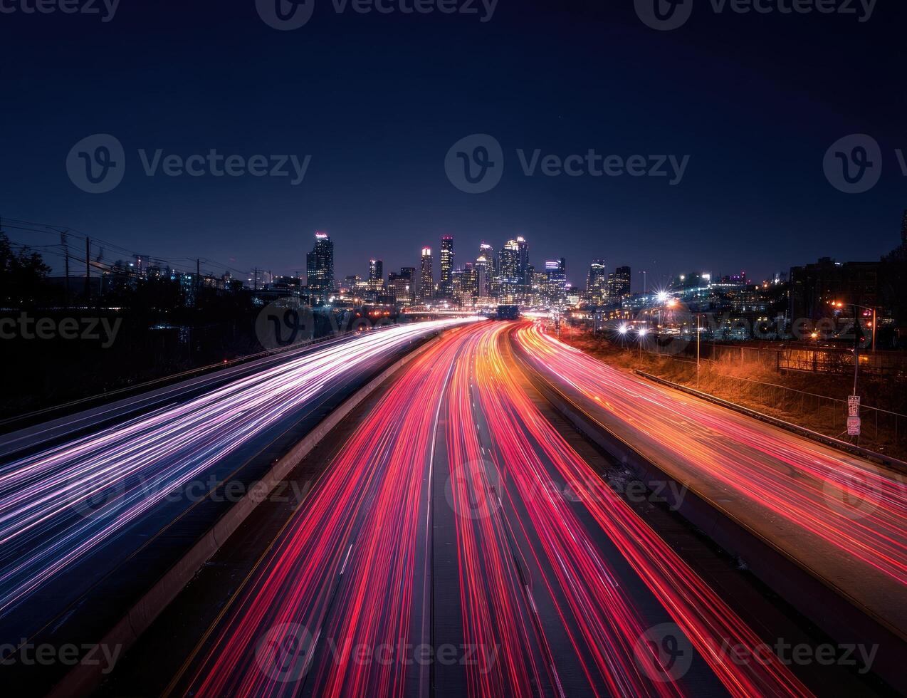 A long exposure photograph of traffic on a highway at night photo