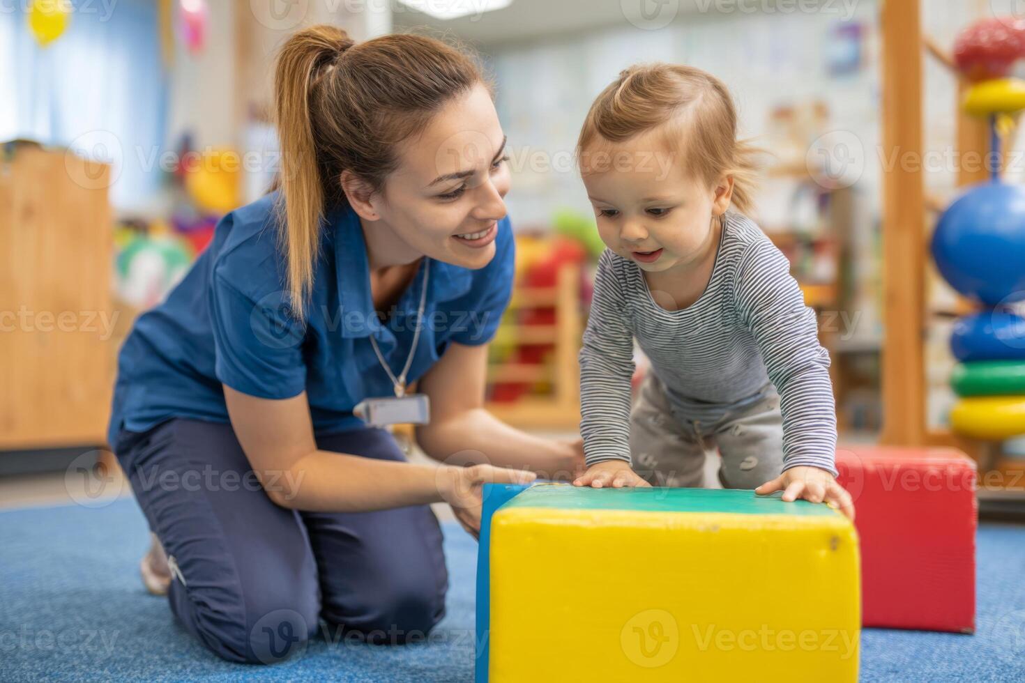 A young child enjoys stacking blocks on a carpet while an attentive adult encourages play in a cheerful learning environment filled with toys and bright colors photo