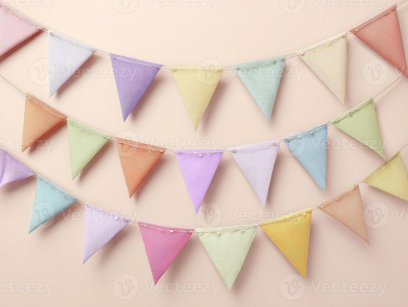 Pastel-colored triangular bunting flags hang in a gentle cascade against a soft peach background photo