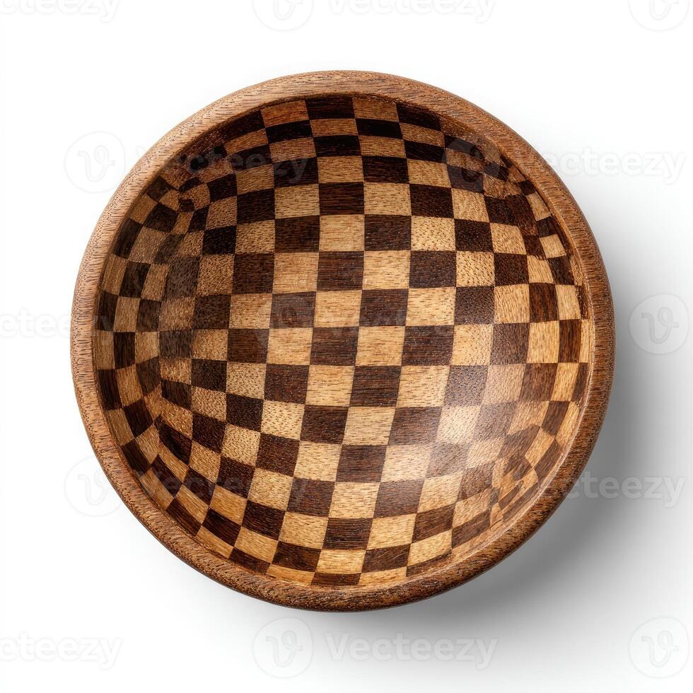 Overhead view of a wooden bowl with a checkerboard pattern inside, set against white photo