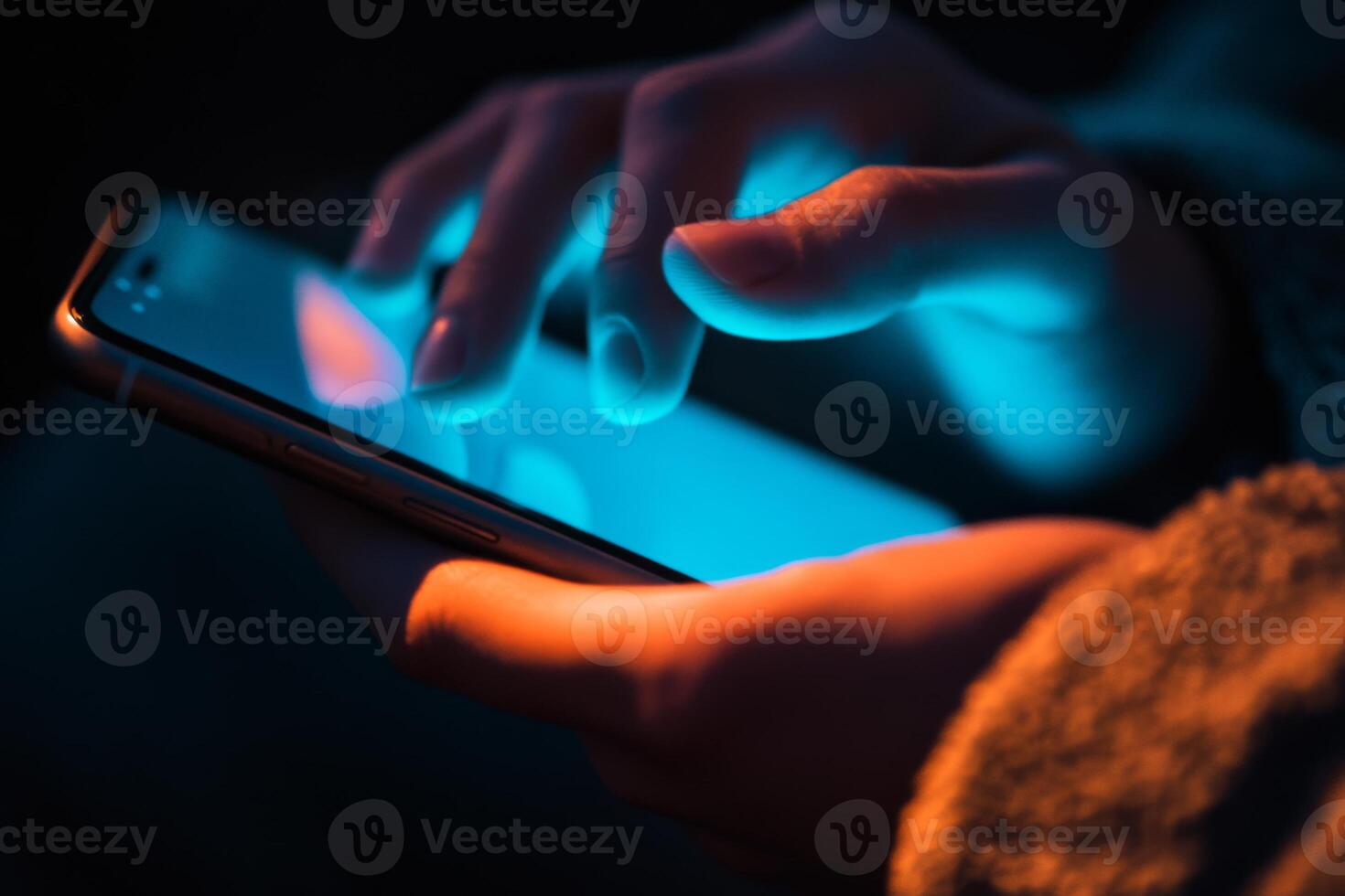Point finger screen phone closeup person testing test message, touch blue screen on smartphone. Night Bokeh Light. Close-UP. Person using in hands mobile phone close up in the dark. Online wi-fi photo