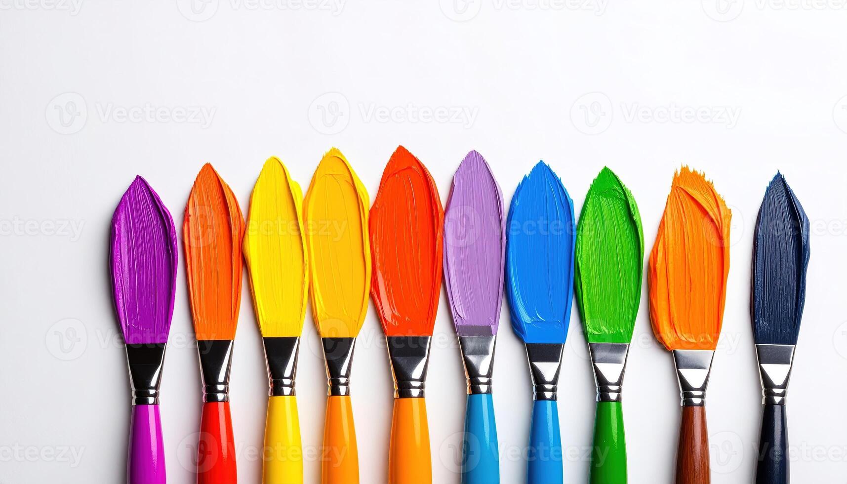 A vibrant array of paintbrushes, each tipped with a different hue, creating a striking color spectrum against a crisp white backdrop. photo